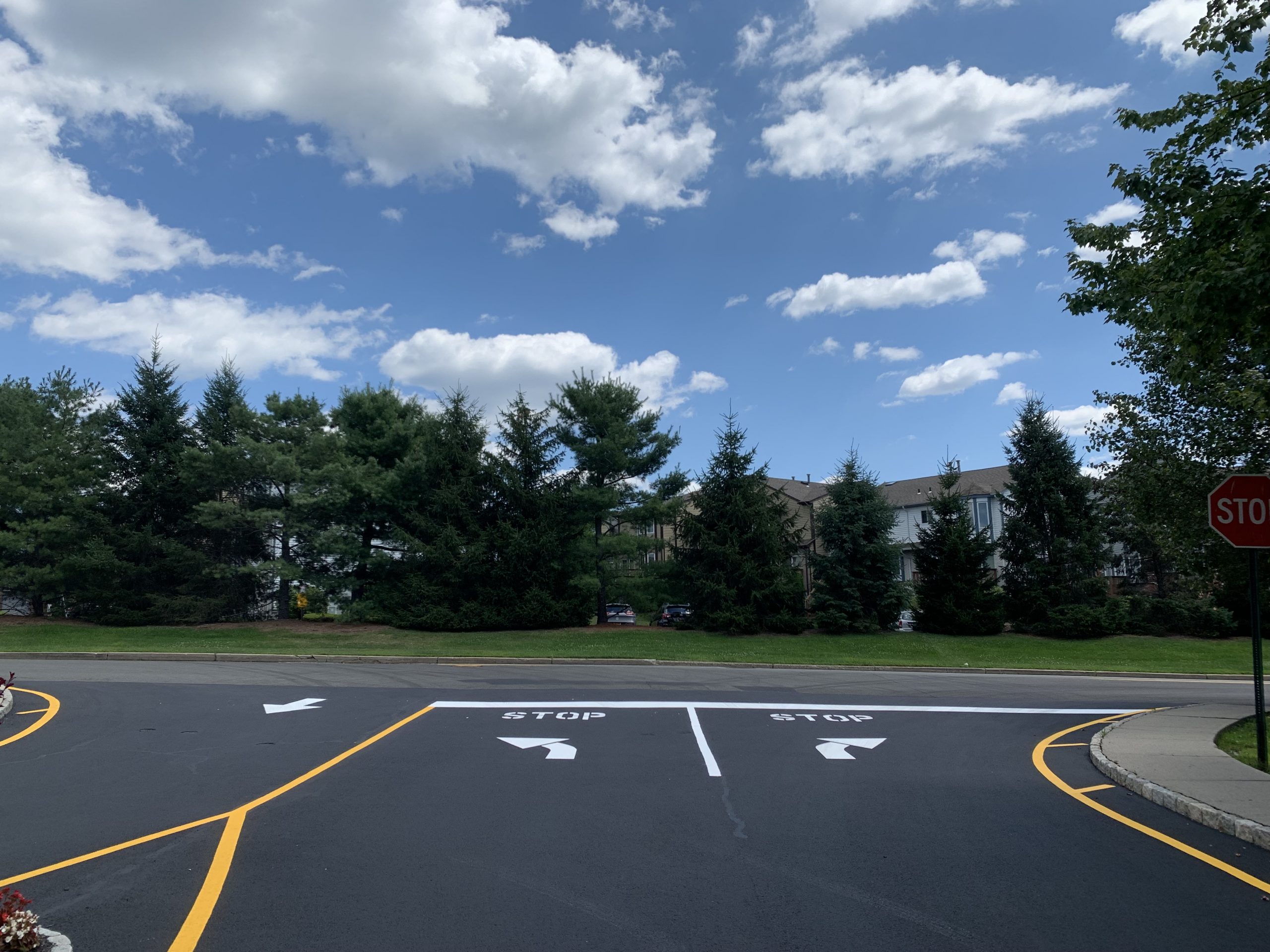 A newly sealed and striped asphalt road