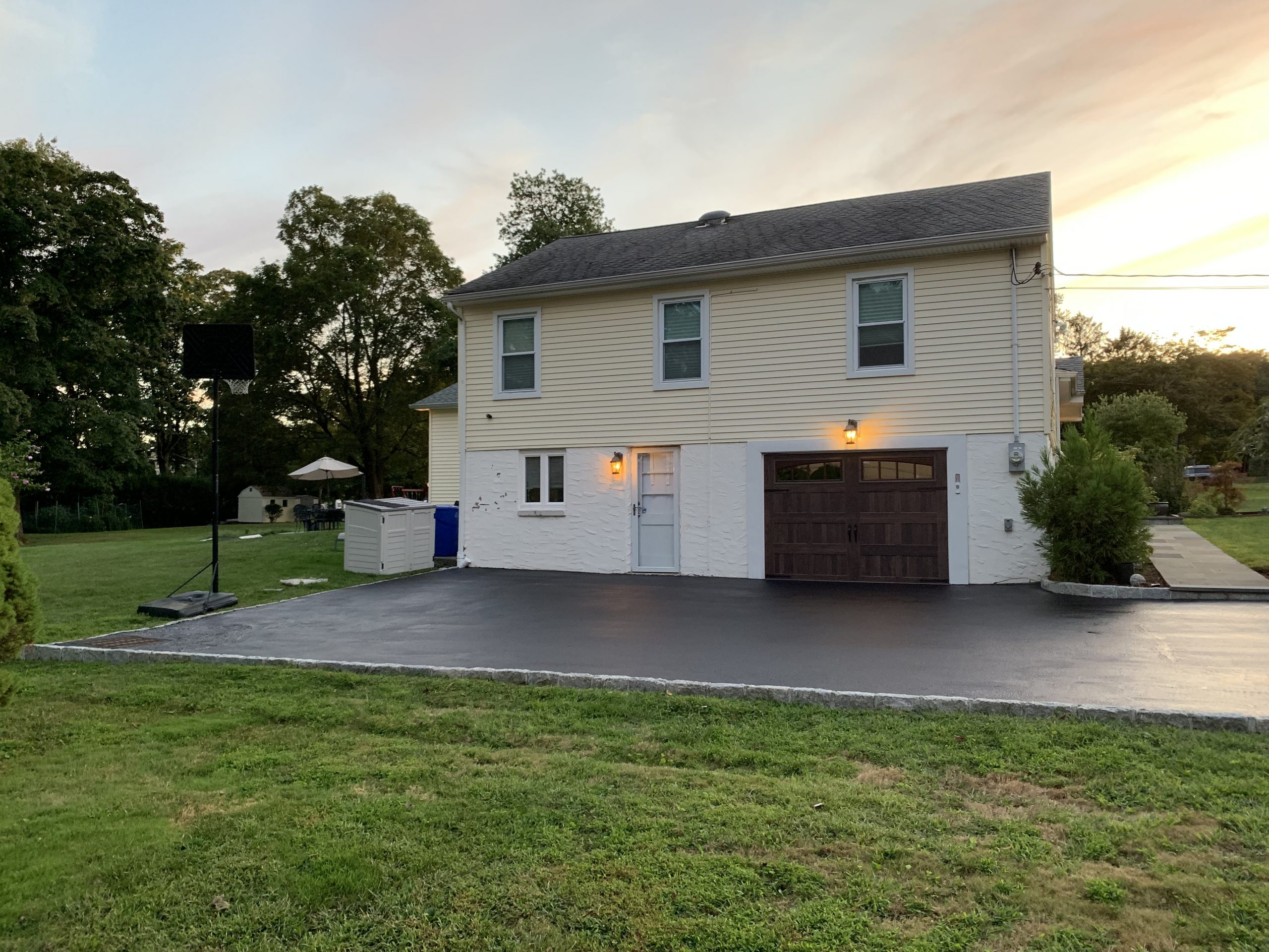 House with newly sealed driveway