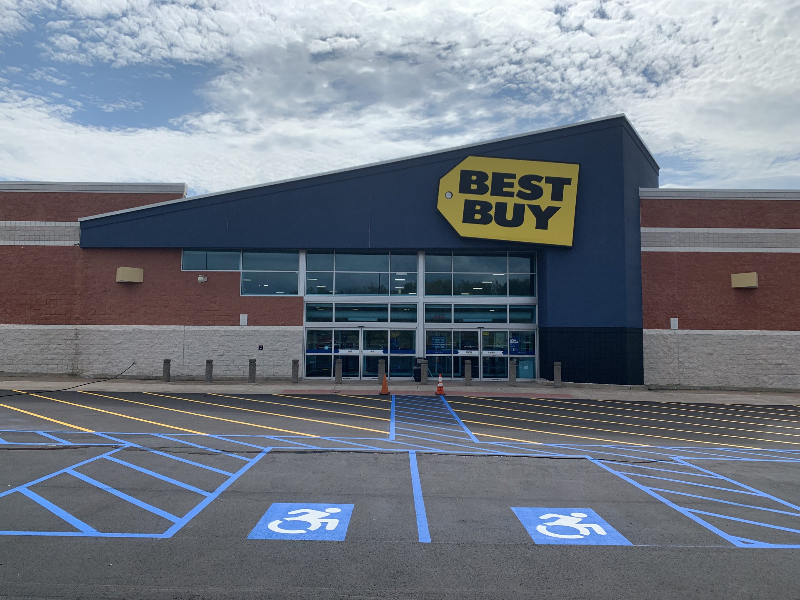 A Best Buy with a newly paved and striped parking lot