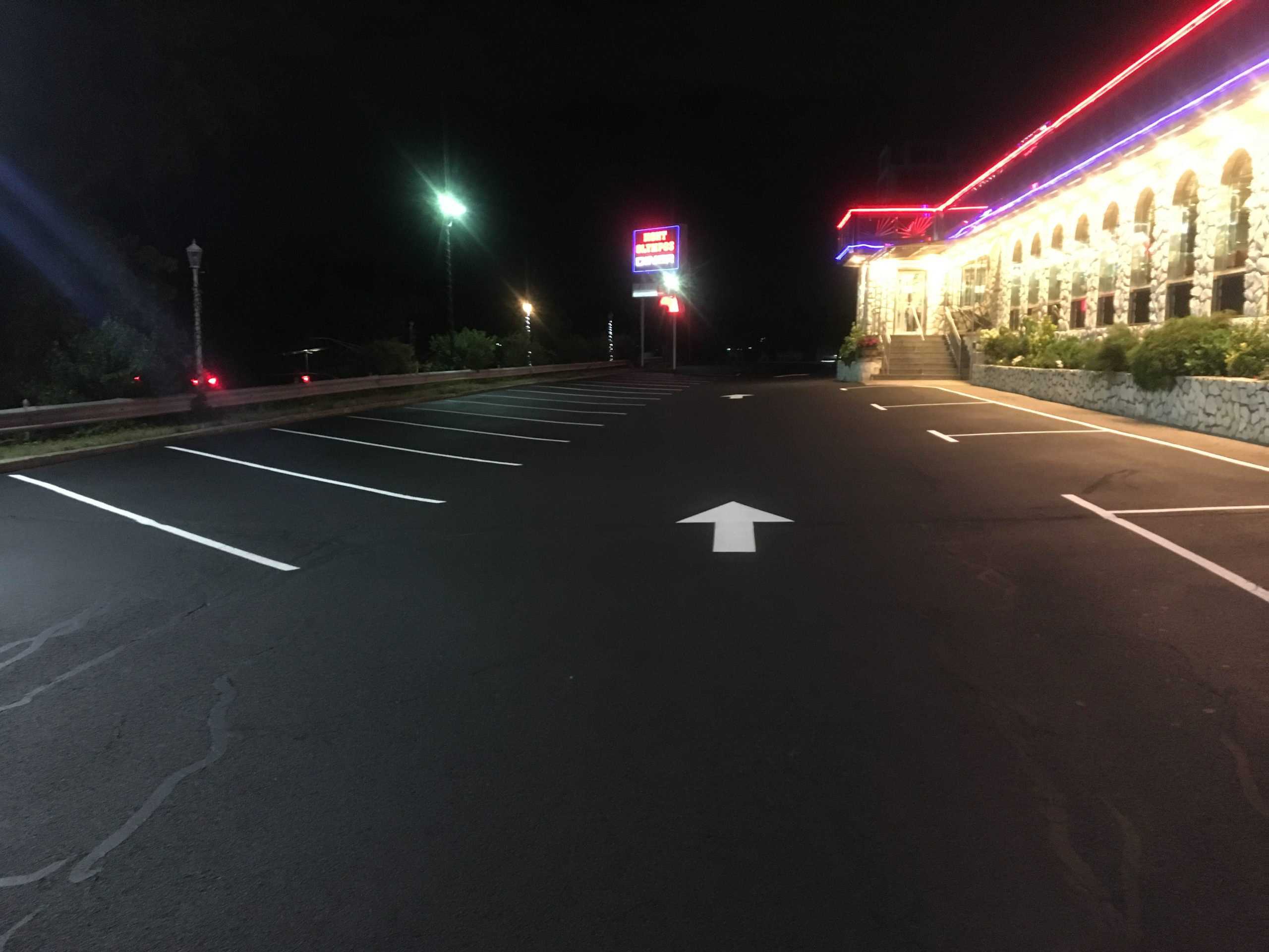 A newly sealcoated and striped parking lot