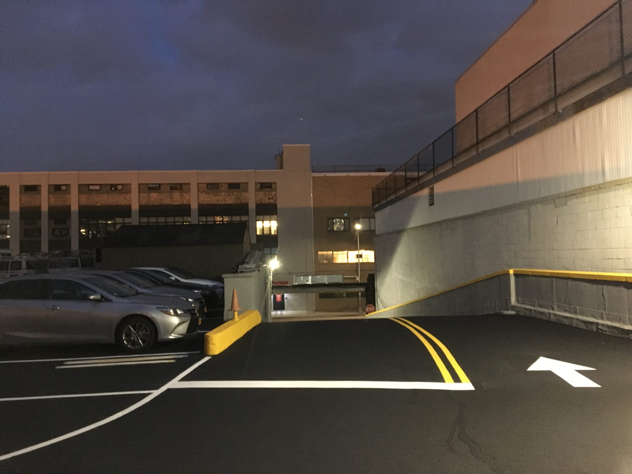 Entrance to parking garage, newly paved and striped